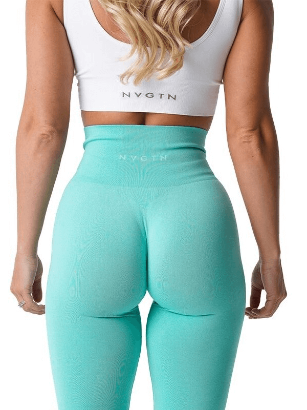 Back view of a woman wearing tight elastic teal sports leggings for fitness activities, showcasing a supportive and stylish design.